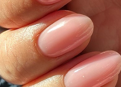 Glossy pastel pink nails at Nails by the Sea, Hartlepool, England, GB.