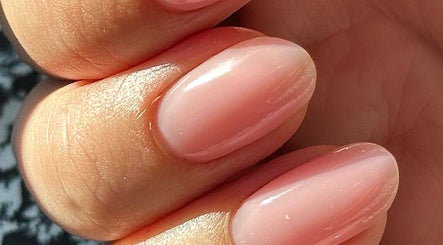 Glossy pastel pink nails at Nails by the Sea, Hartlepool, England, GB.