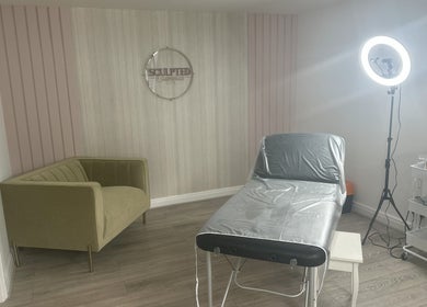 Modern beauty treatment room at Sculpted Cosmetics Ltd, Orpington, England, GB with sleek decor and lighting.