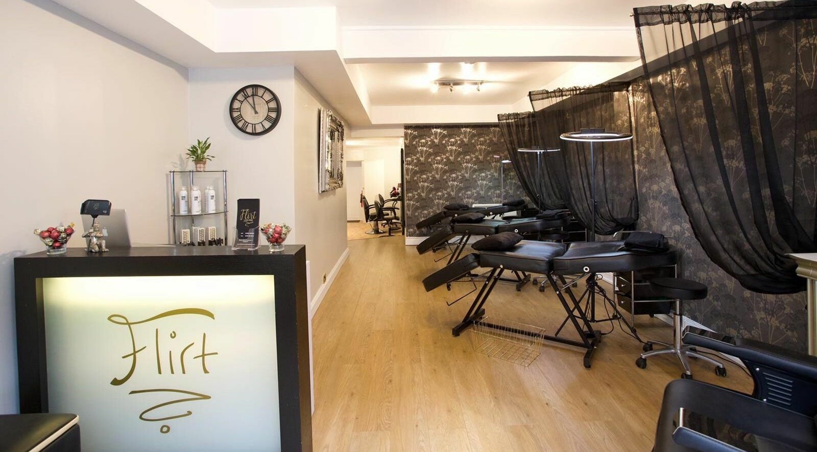 Spacious and elegant interior of Flirt Lash & Brow Bar in Leamington Spa, England, GB featuring treatment beds.