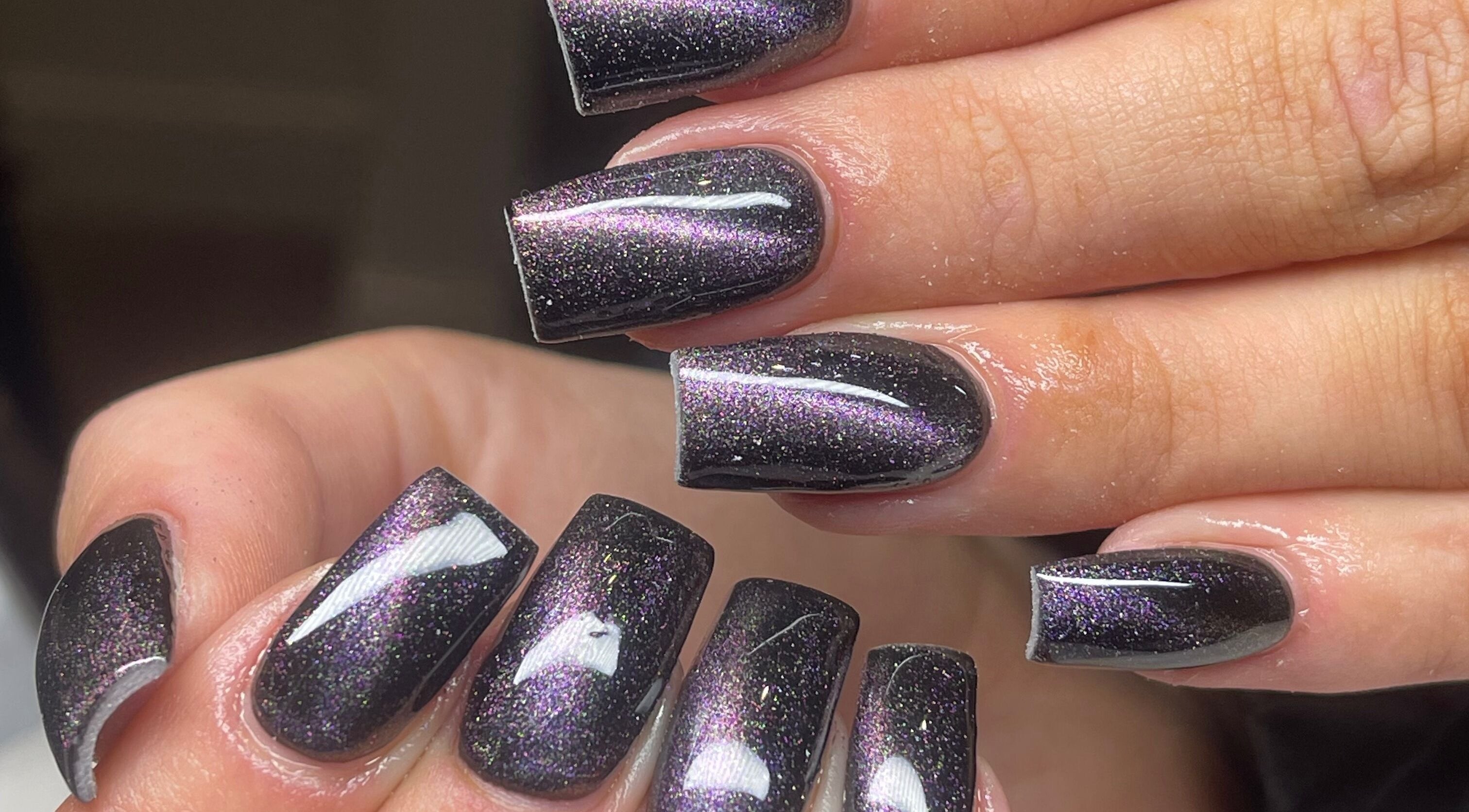 Glossy black and purple nails at Millie’s Beauty Room, Douglas, Douglas, IM.