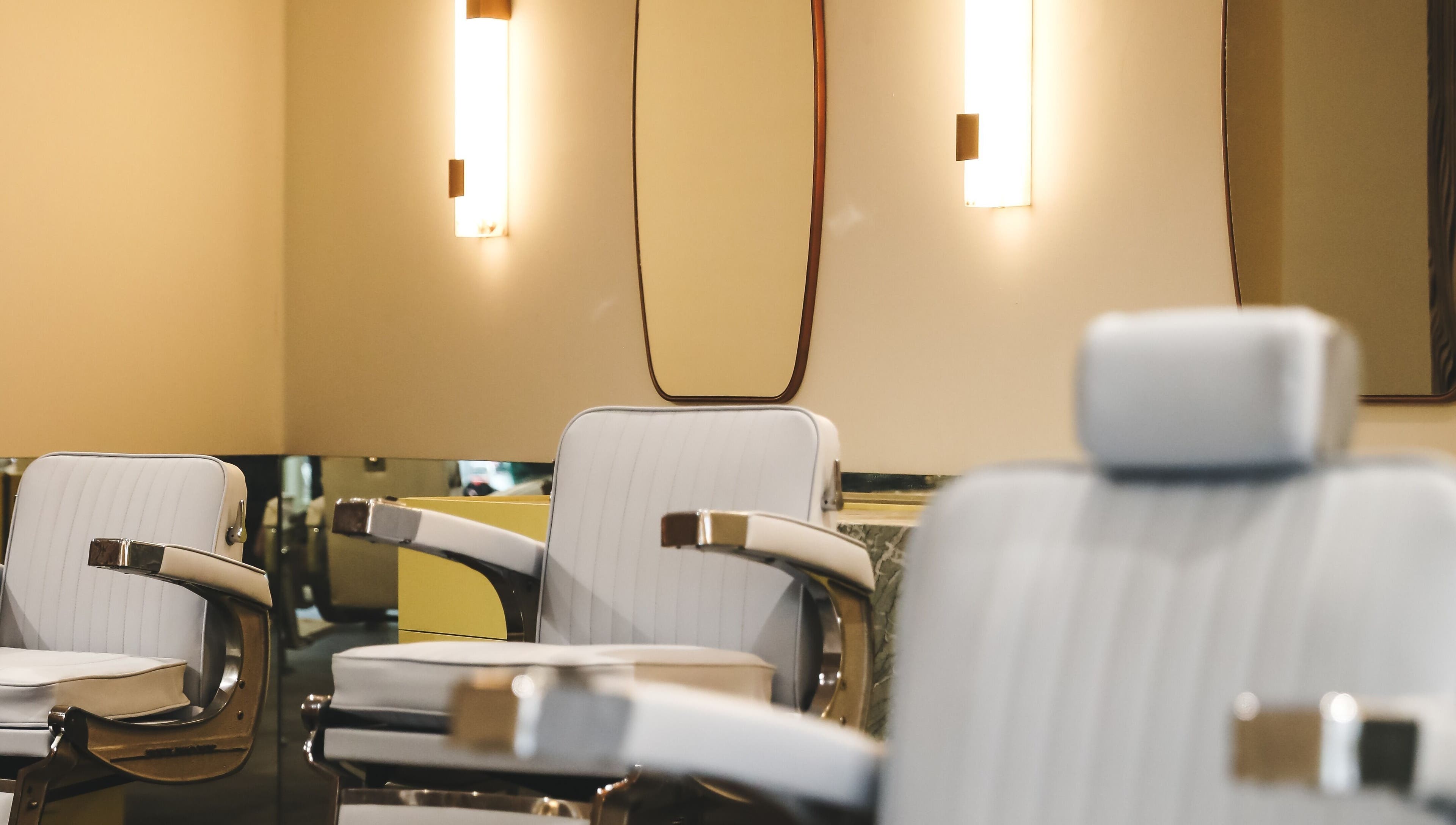 Elegant salon chairs at Cut Throat - West, Amsterdam, Noord-Holland, NL, showcasing modern design.