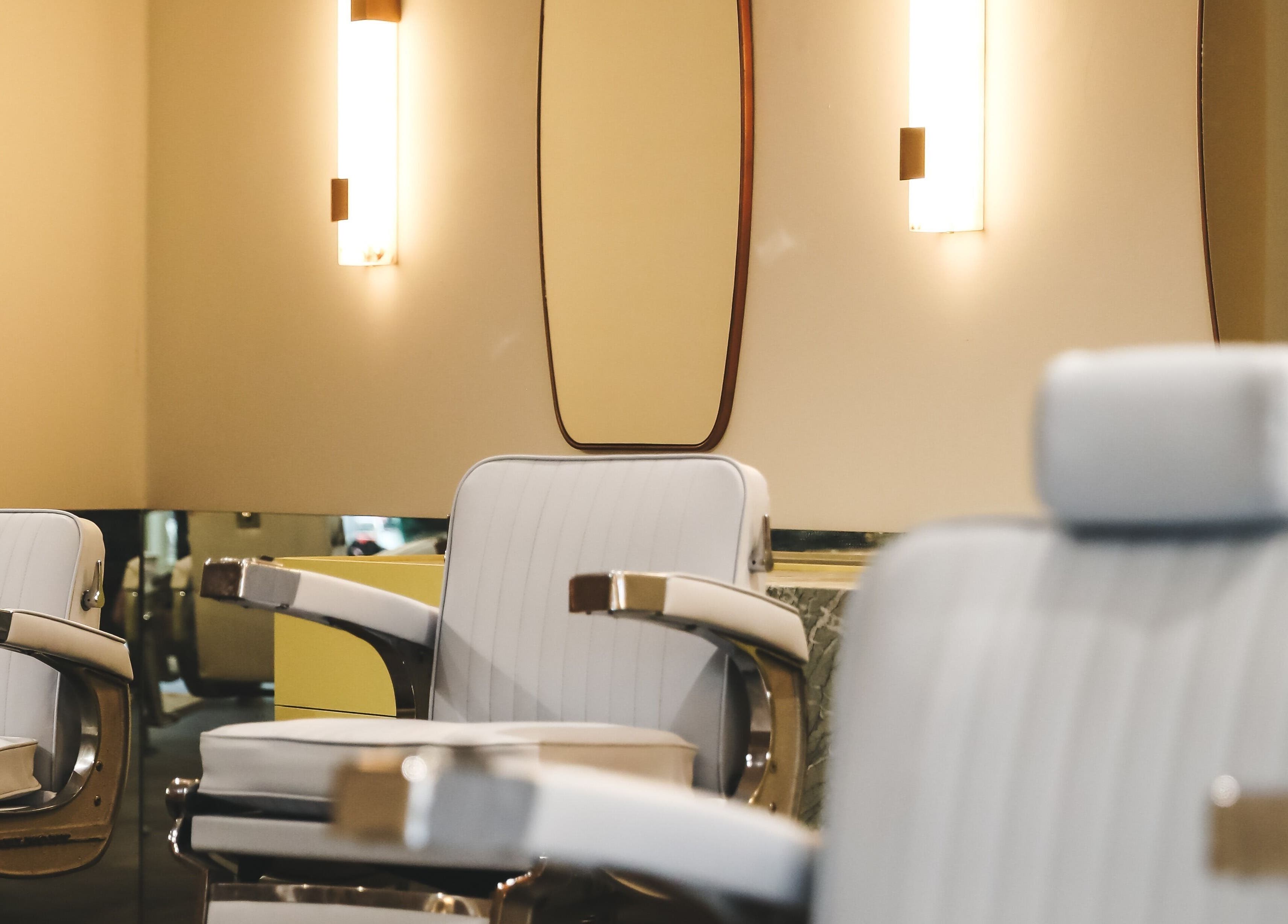 Elegant salon chairs at Cut Throat - West, Amsterdam, Noord-Holland, NL, showcasing modern design.