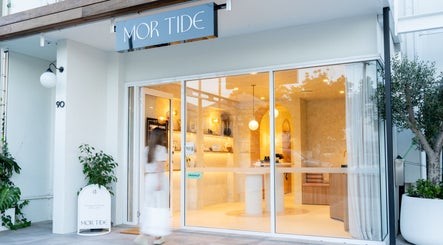 Entrance of Mor Tide Day Spa in Fortitude Valley, Queensland, AU with welcoming decor and glass doors.