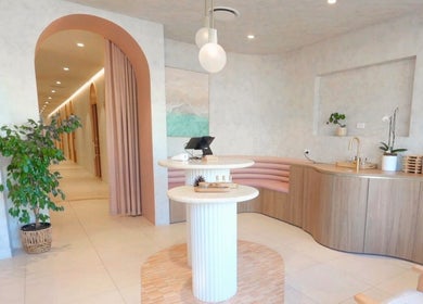 Elegant modern interior of Mor Tide Day Spa in Fortitude Valley, Queensland, AU with soothing decor and greenery.