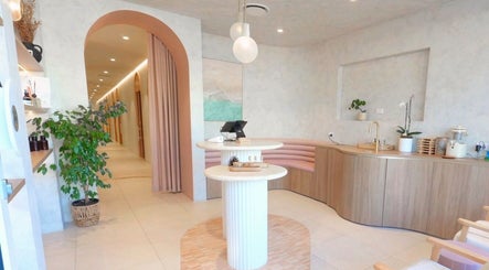 Elegant modern interior of Mor Tide Day Spa in Fortitude Valley, Queensland, AU with soothing decor and greenery.
