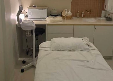Relaxing treatment room at Mor Tide Day Spa, Fortitude Valley, Queensland, AU with massage bed and soft lighting.
