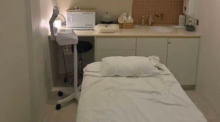 Relaxing treatment room at Mor Tide Day Spa, Fortitude Valley, Queensland, AU with massage bed and soft lighting.