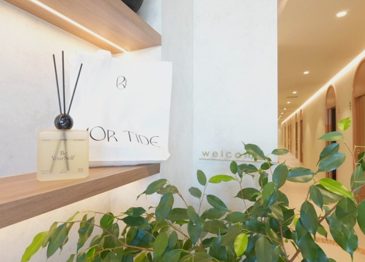 Shelf at Mor Tide Day Spa in Fortitude Valley, Queensland, AU with diffuser and greenery, inviting relaxation.