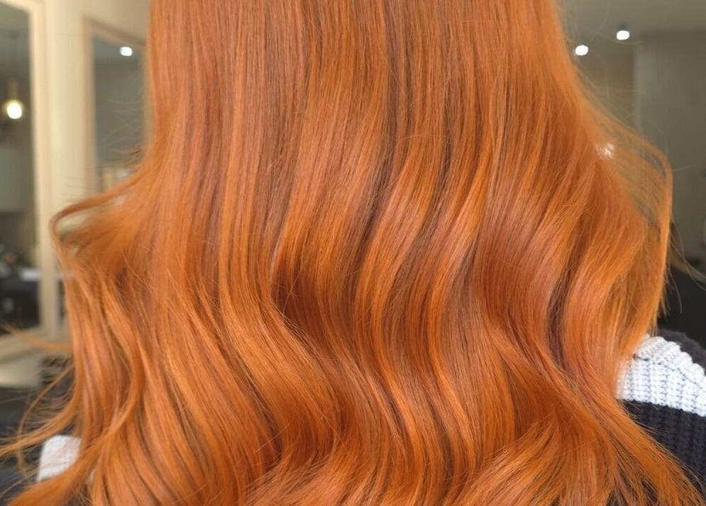 Vibrant copper hair waves styled at Kerry Carroll Hair design (At JFK), Edinburgh, Scotland, GB.