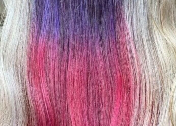 Colorful hair design at Kerry Carroll Hair Design (At JFK), Edinburgh, Scotland, GB. Vibrant pink and purple hues.