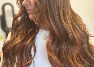 Radiant wavy hair styled at Emma Conroy Hair, Widnes, England, GB, showcasing vibrant color and sleek texture.