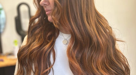 Radiant wavy hair styled at Emma Conroy Hair, Widnes, England, GB, showcasing vibrant color and sleek texture.