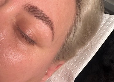 Close-up of a well-groomed brow at Lashandbrowbar_gc, Hope Island, Queensland, AU. Smooth skin and peaceful rest.