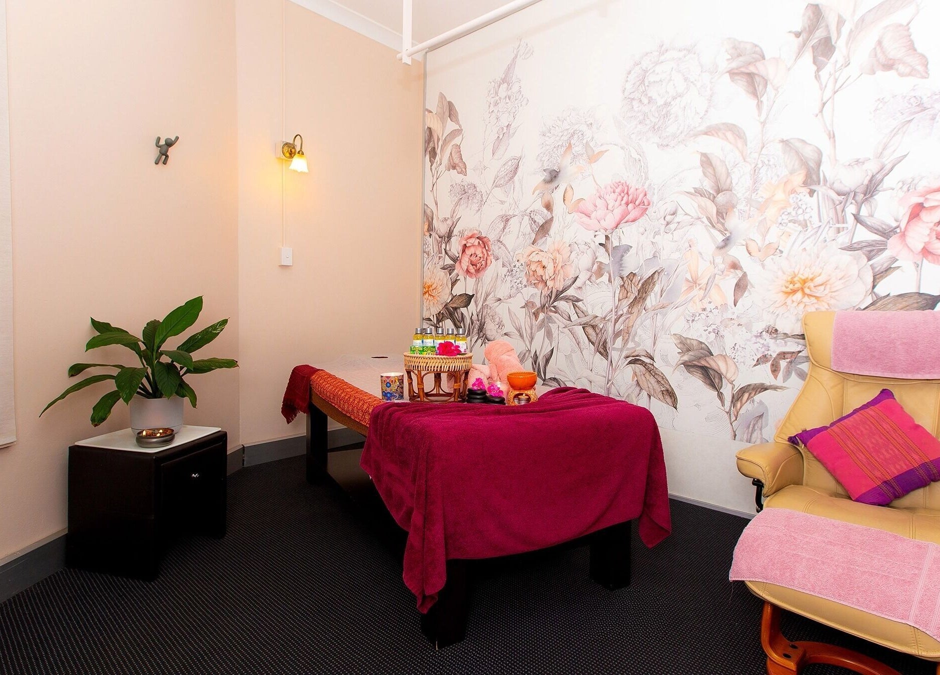 Relaxation room at Chat Thai Massage in Crows Nest, New South Wales, AU featuring floral decor and massage table.