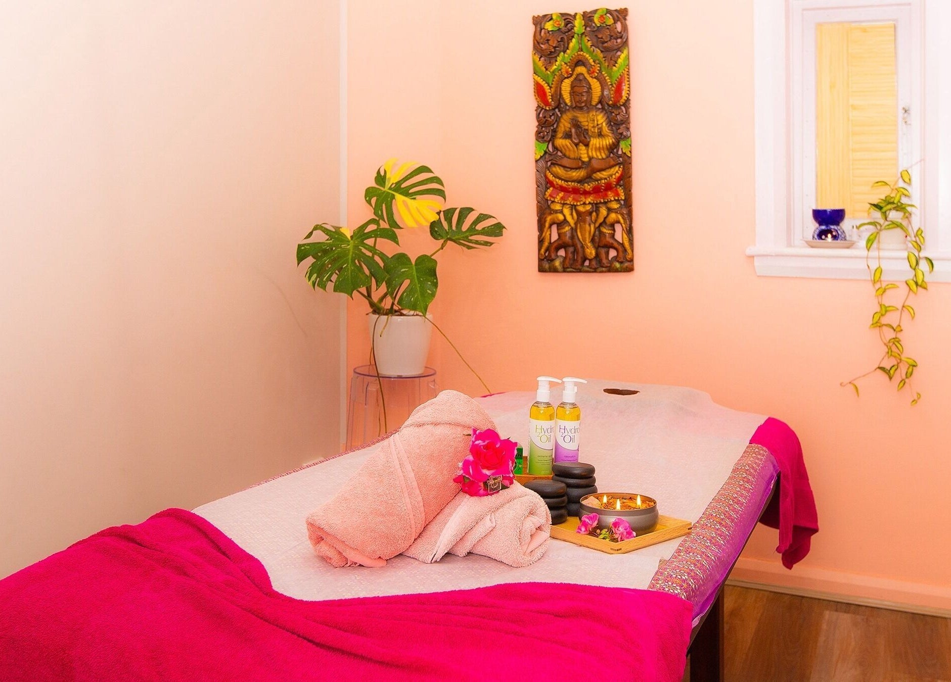 Tranquil massage room at Chat Thai Massage, Crows Nest, New South Wales, AU, featuring a massage bed and decorations.