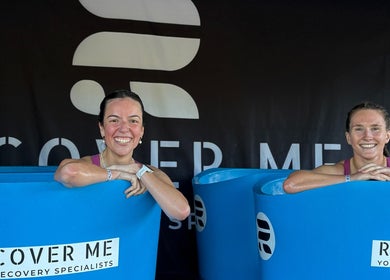 Two women smiling while enjoying recovery baths at Turf Games - Auckland, Auckland, Auckland, NZ.