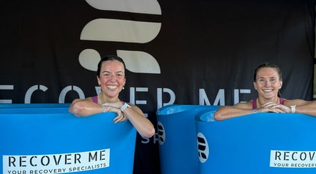 Two women smiling while enjoying recovery baths at Turf Games - Auckland, Auckland, Auckland, NZ.