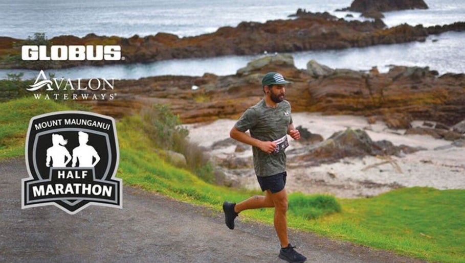Runner in Mt Maunganui Half Marathon, Bay Of Plenty Region, NZ, along scenic coastal path.