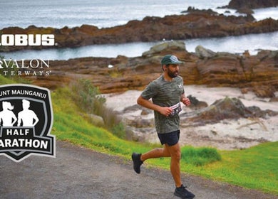 Runner in Mt Maunganui Half Marathon, Bay Of Plenty Region, NZ, along scenic coastal path.