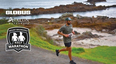 Runner in Mt Maunganui Half Marathon, Bay Of Plenty Region, NZ, along scenic coastal path.