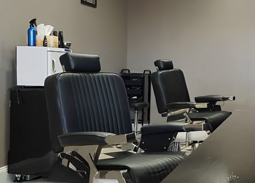 Elegant black barber chairs at Thrones Barber and Stylists, Parkwood, Queensland, AU.