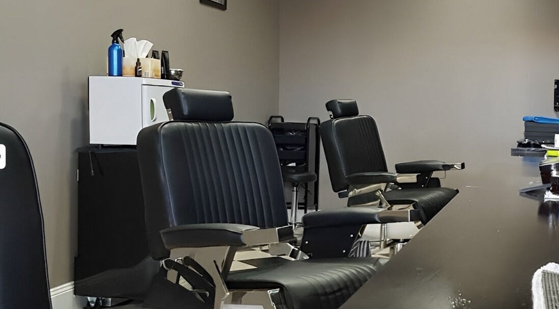 Elegant black barber chairs at Thrones Barber and Stylists, Parkwood, Queensland, AU.