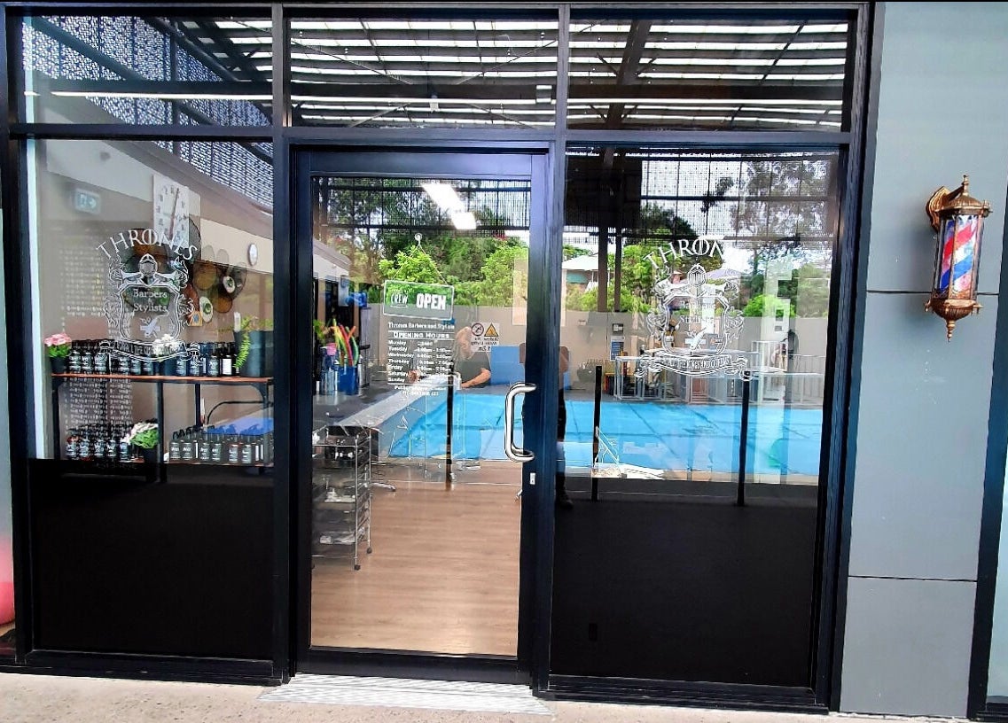Entrance of Thrones Barber and Stylists in Parkwood, Queensland, AU showcasing stylish interior.