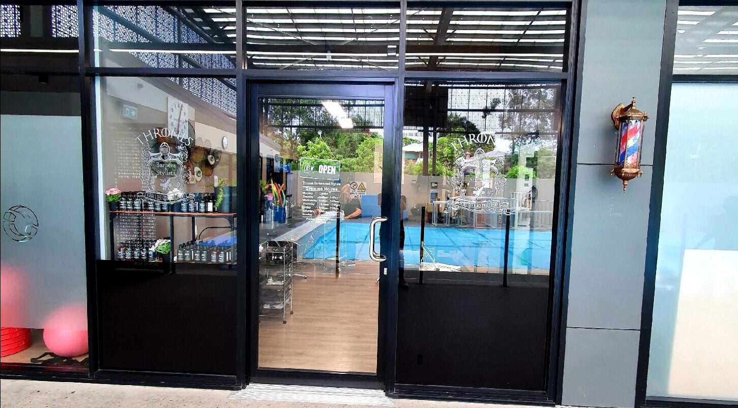 Entrance of Thrones Barber and Stylists in Parkwood, Queensland, AU showcasing stylish interior.