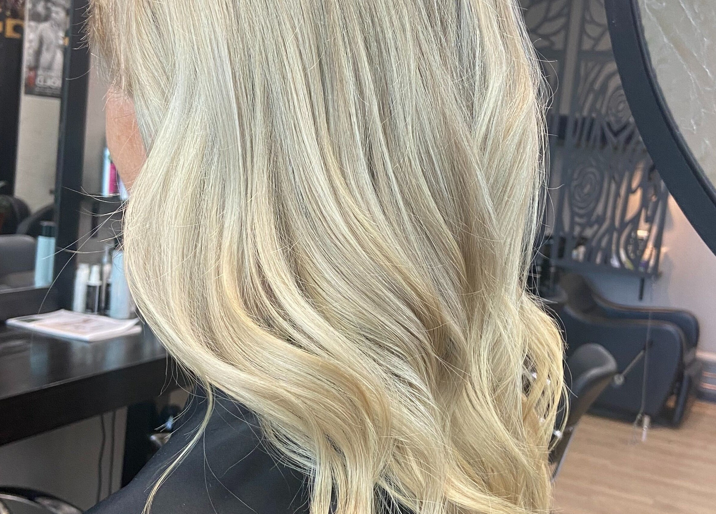 Blonde hair styled at Thrones Barber and Stylists in Parkwood, Queensland, AU salon interior.