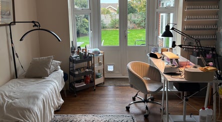 Bright, stylish beauty room at The Brow & Nail Lounge, Worthing, England, GB with desk and treatment bed.