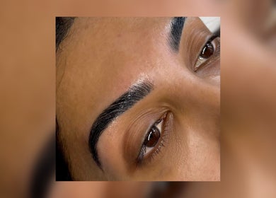 Perfectly shaped eyebrows at The Brow & Nail Lounge, Worthing, England, GB. High-quality beauty service depicted.