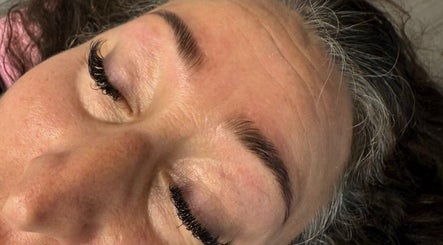 Woman with styled lashes at The Brow & Nail Lounge, Worthing, England, GB, showcasing beauty services.