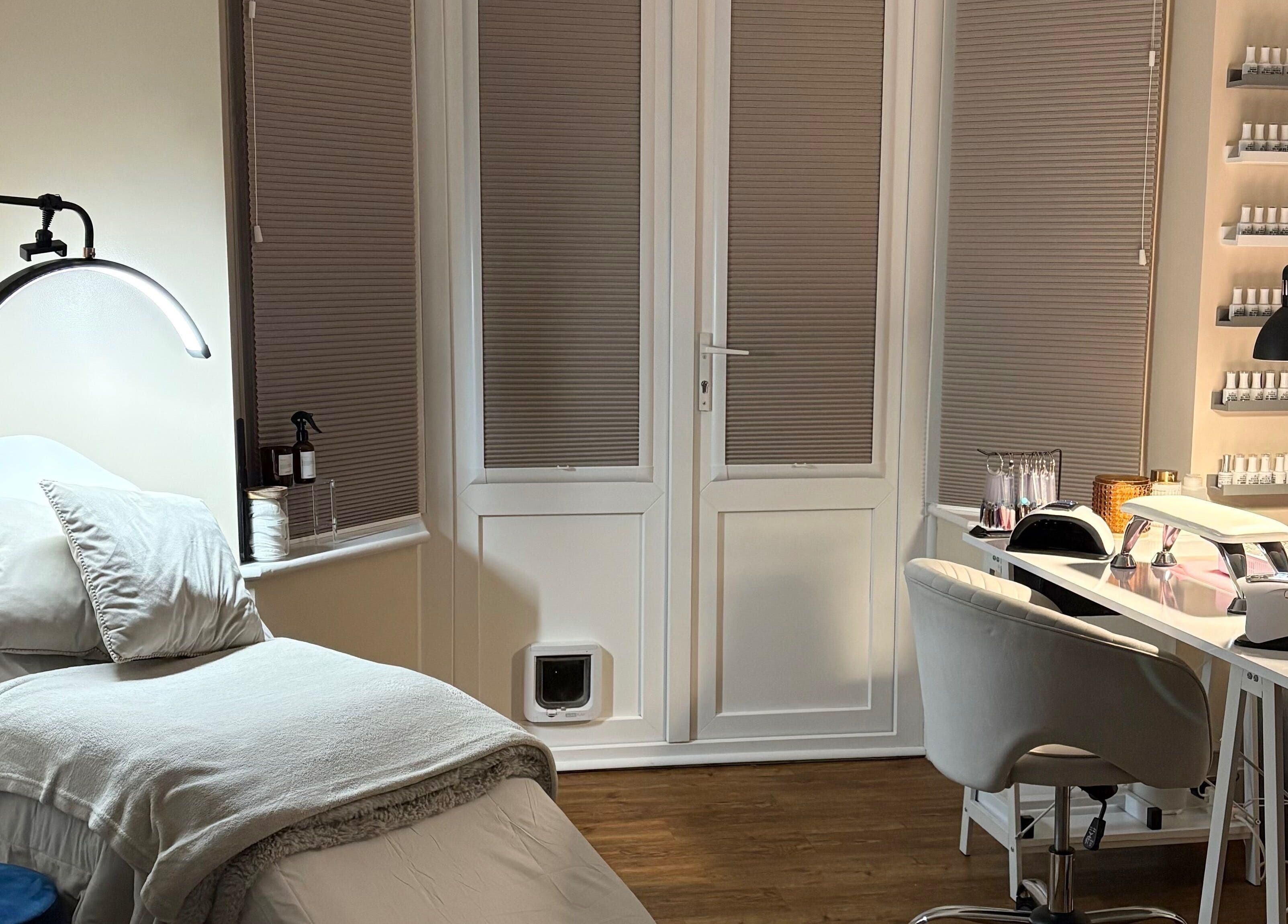 Relaxing interior of The Brow & Nail Lounge, Worthing, England, GB, featuring nail care station and treatment bed.