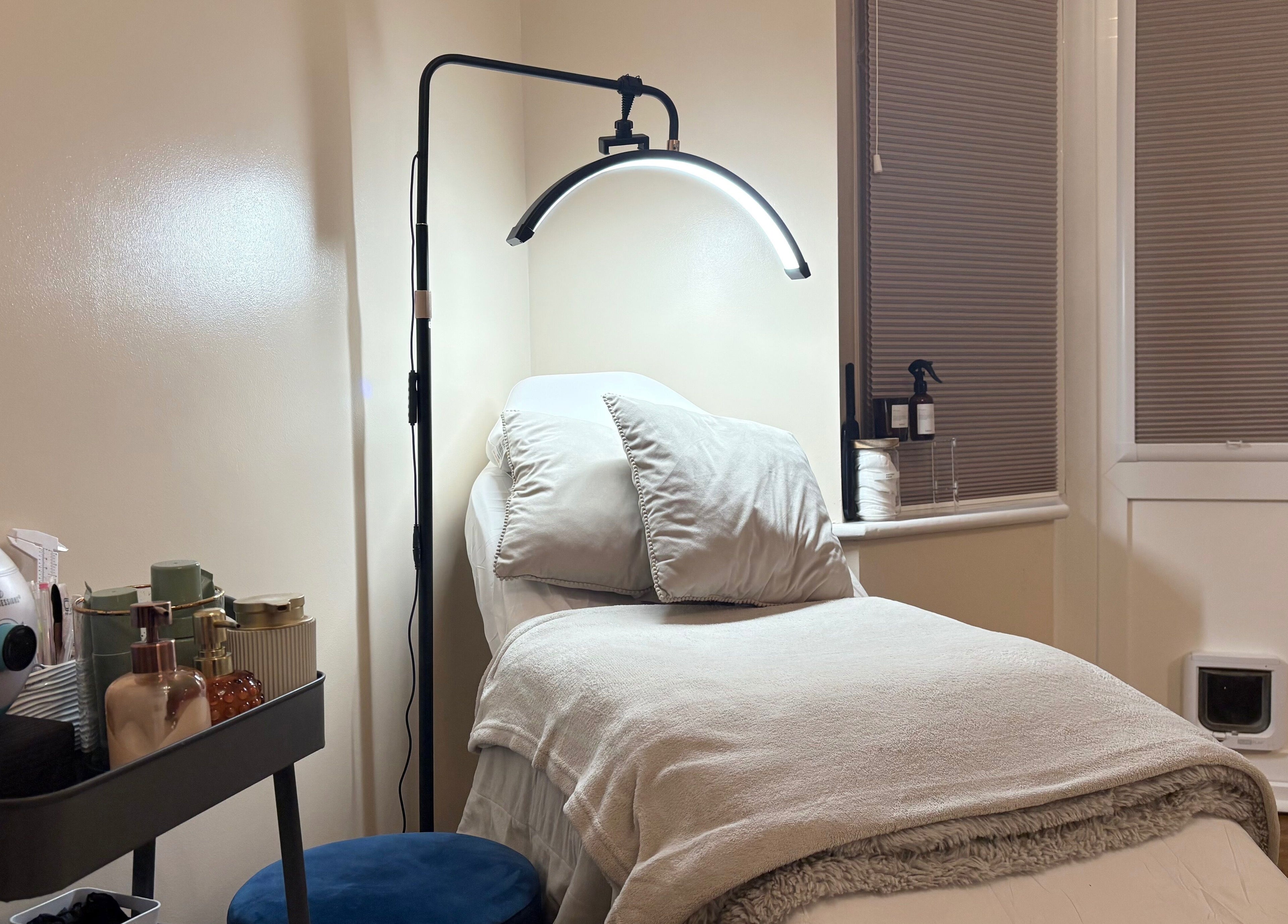 Relaxing treatment room at The Brow & Nail Lounge, Worthing, England, GB with a plush bed and gentle lighting.