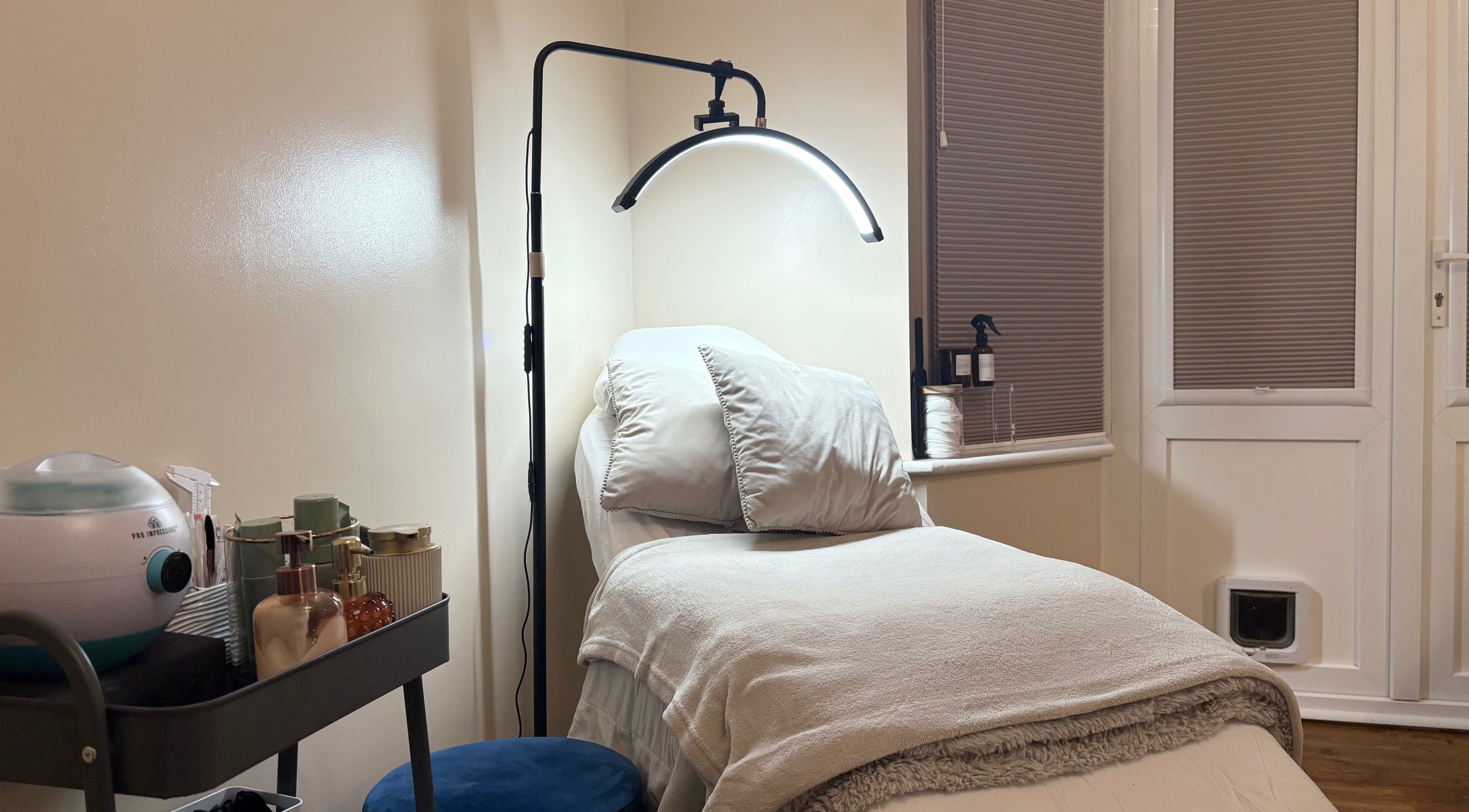 Relaxing treatment room at The Brow & Nail Lounge, Worthing, England, GB with a plush bed and gentle lighting.