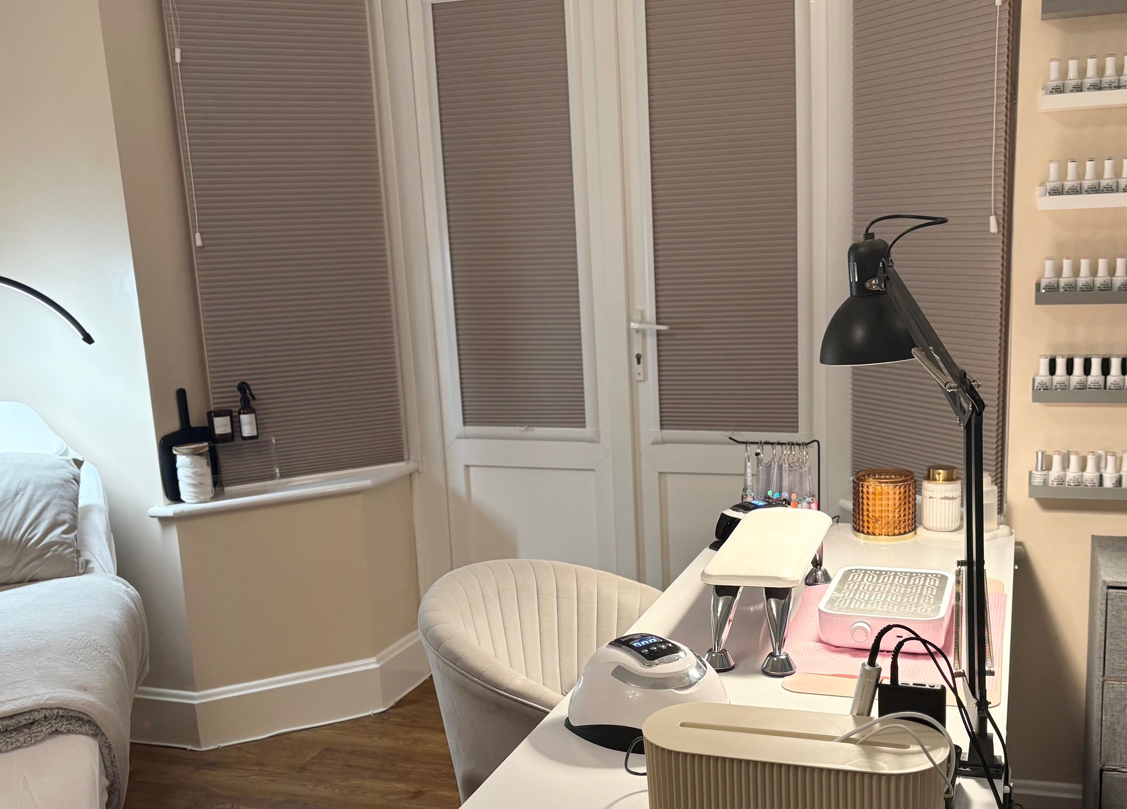 Bright, serene beauty setup at The Brow & Nail Lounge, Worthing, England, GB with nail polish display.