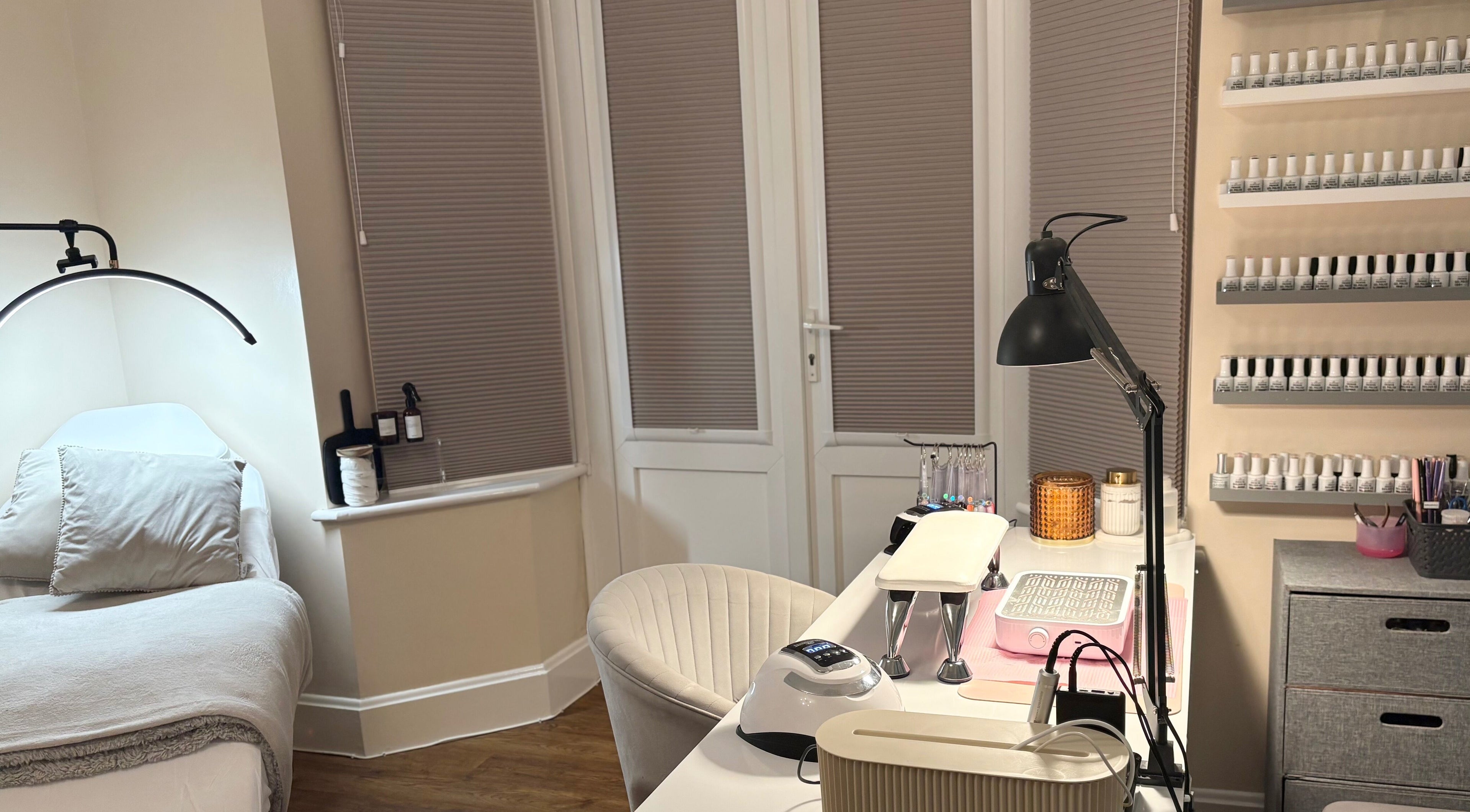 Bright, serene beauty setup at The Brow & Nail Lounge, Worthing, England, GB with nail polish display.