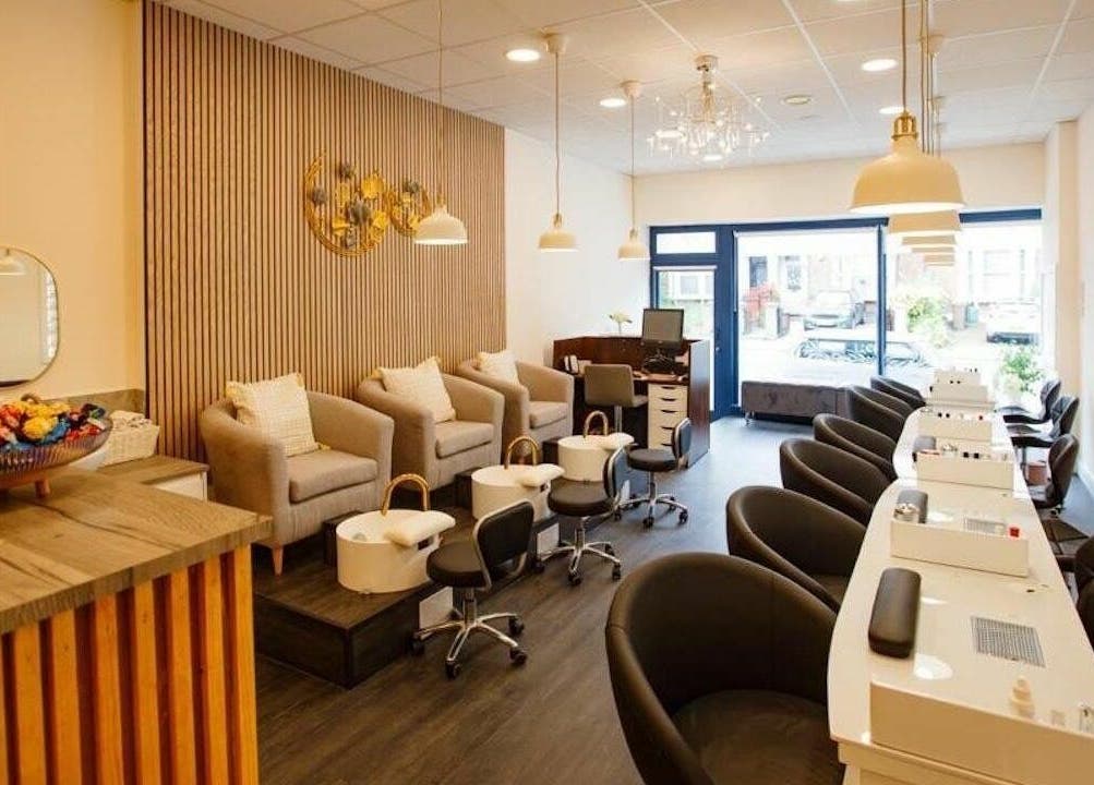 Interior of D'lux Nails and Beauty Salon showing luxury nail stations in London, England, GB.