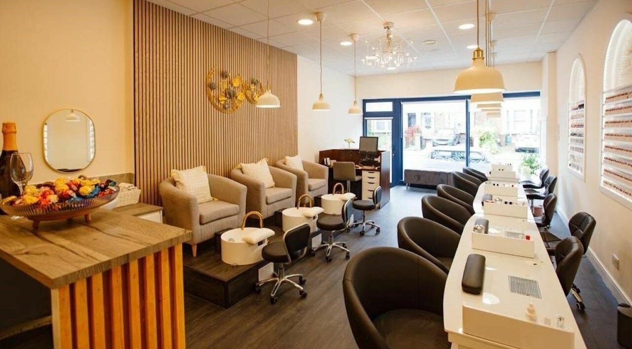Interior of D'lux Nails and Beauty Salon showing luxury nail stations in London, England, GB.