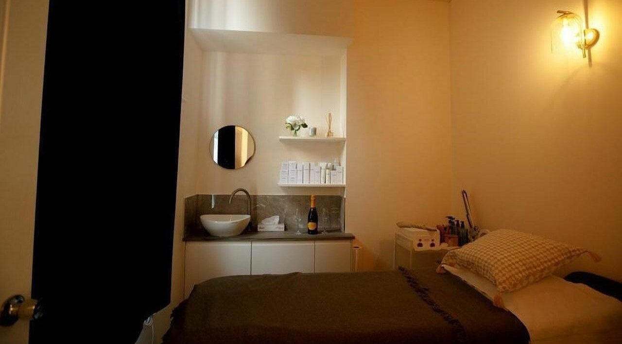 Cozy treatment room at D'lux Nails and Beauty Salon in London, England, GB, featuring a stylish sink and decor.