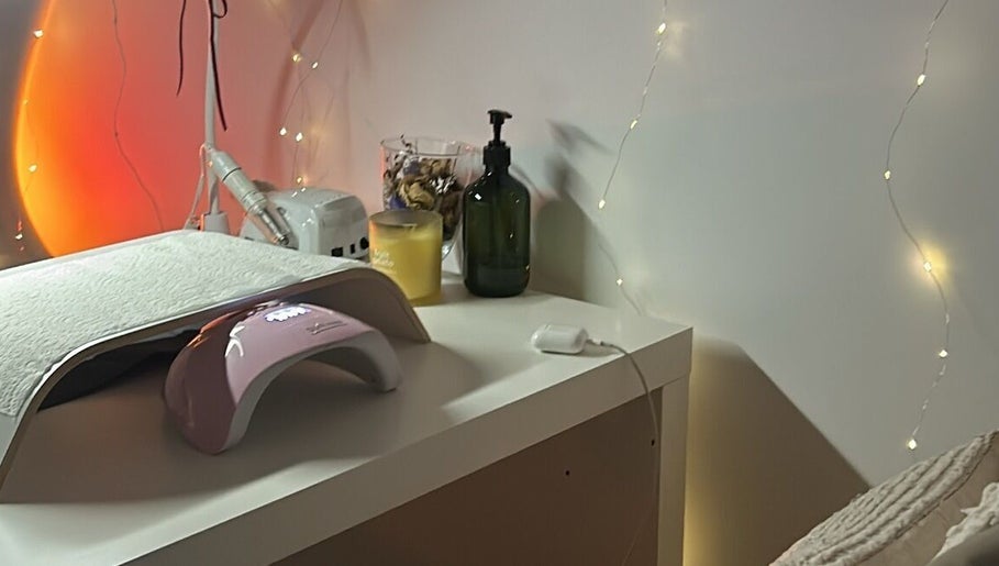 Cozy nail station at Allure Nails in North Lakes, Queensland, AU with ambient lighting and sleek tools.