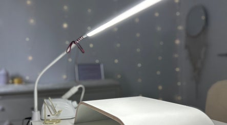 Nail station at Allure Nails, North Lakes, Queensland, AU, showcasing modern equipment under soft lighting.