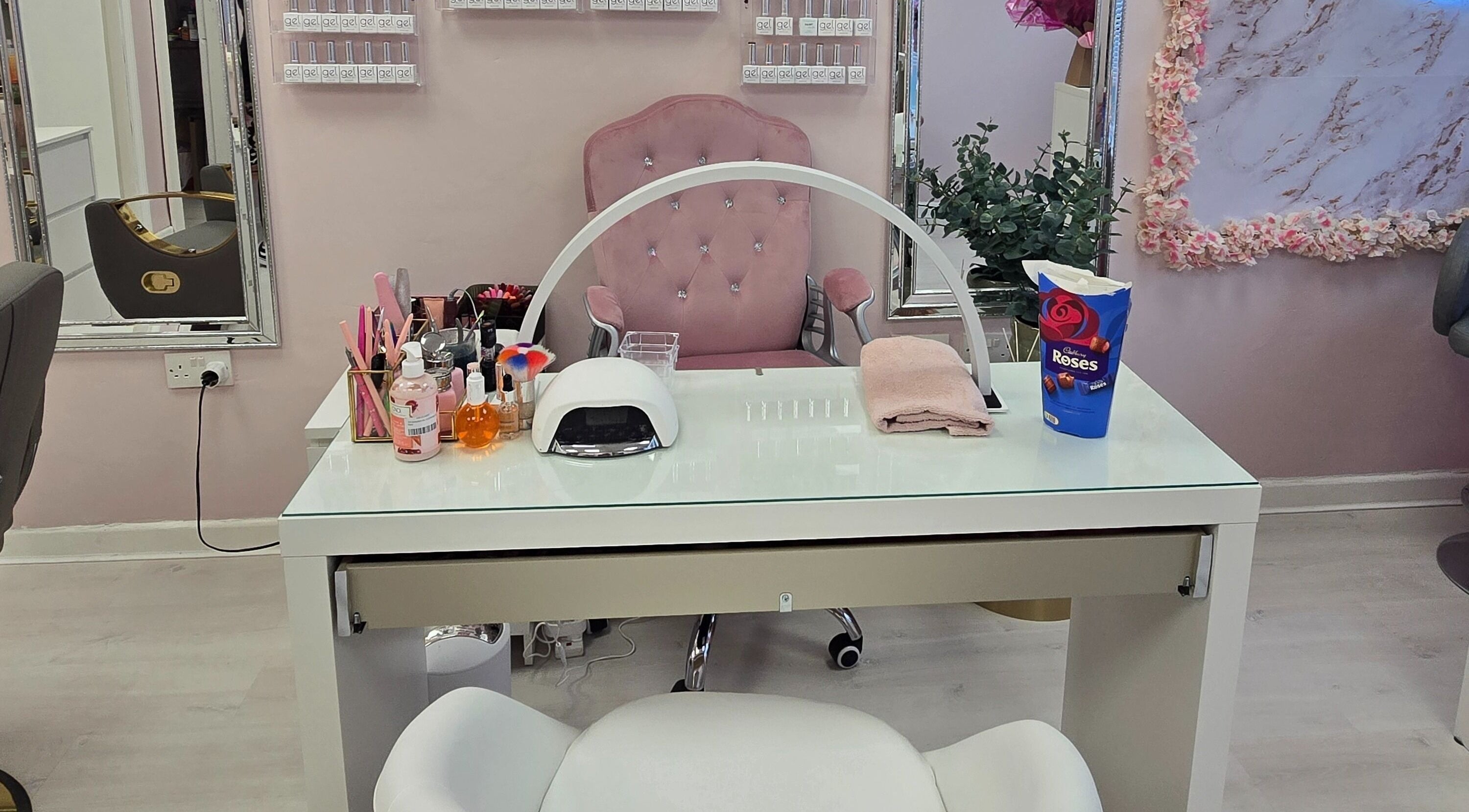 Elegant manicure setup at Embrace Beauty By Ria, Carlow, County Carlow, IE with pink decor and tools.