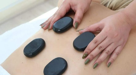 Hot stone massage at Izghawa Branch, الريان, الريان, QA enhances relaxation and wellness.