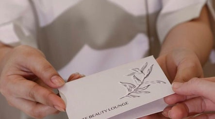 Receiving a beauty lounge card at Izghawa Branch, الريان, الريان, QA. A symbol of luxury and care.