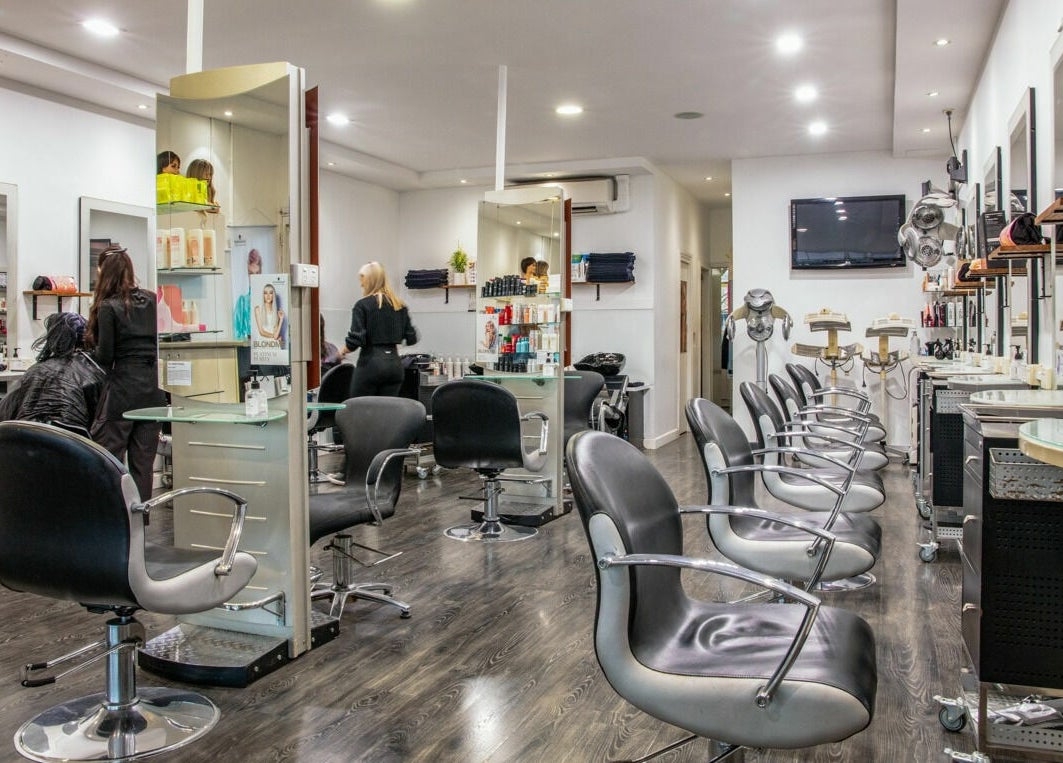 Inside Maddness Hair Design salon in Bundoora, Victoria, AU with modern styling stations.