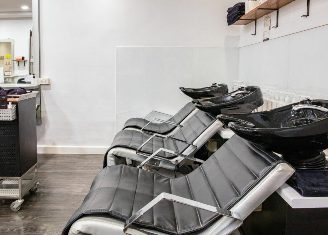 Modern wash stations at Maddness Hair Design, Bundoora, Victoria, AU, highlighting sleek salon setup.