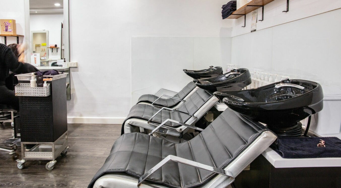 Modern wash stations at Maddness Hair Design, Bundoora, Victoria, AU, highlighting sleek salon setup.