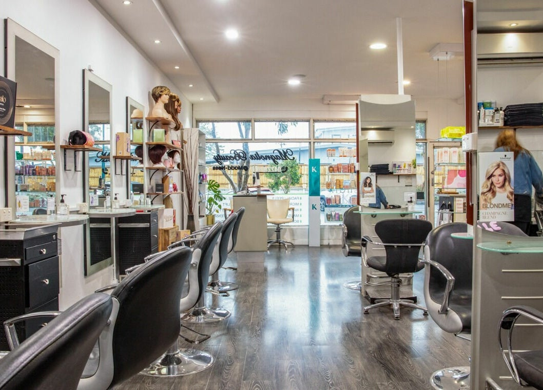 Modern interior of Maddness Hair Design in Bundoora, Victoria, AU featuring stylist chairs and mirrors.